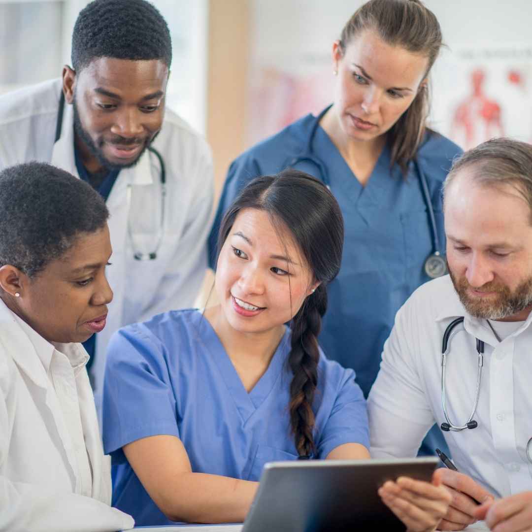 Healthcare professionals learning with each other using a tablet